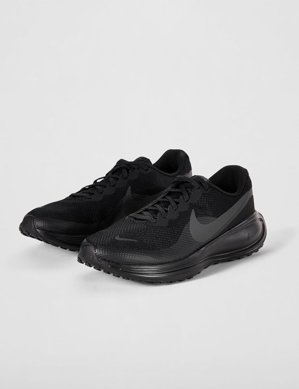 Provides a clean, catalog-style view of the Nike running shoes on a neutral background to show the product clearly without distractions.