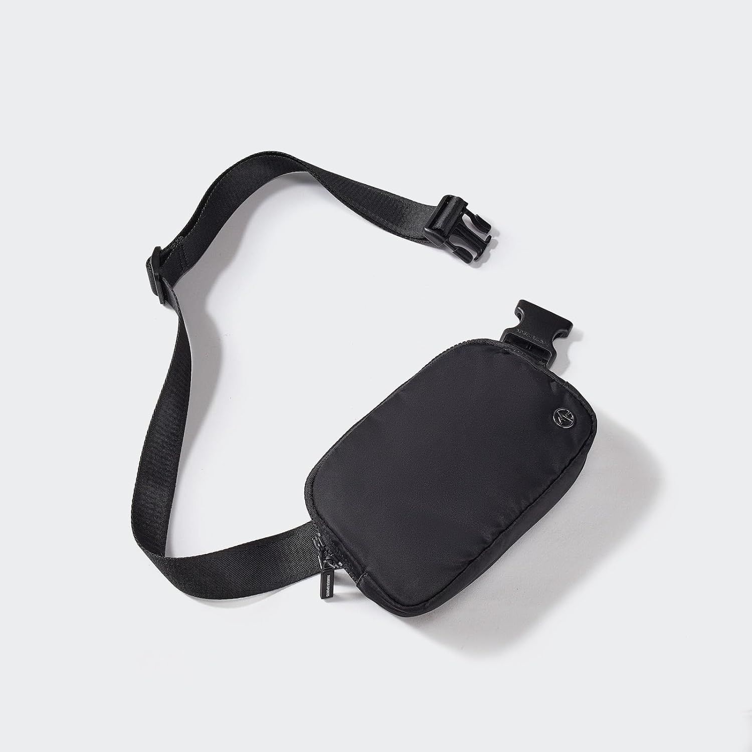 Provides a clean, catalog-style view of the black belt bag with adjustable strap and buckle closure, allowing shoppers to see the product clearly without distractions.