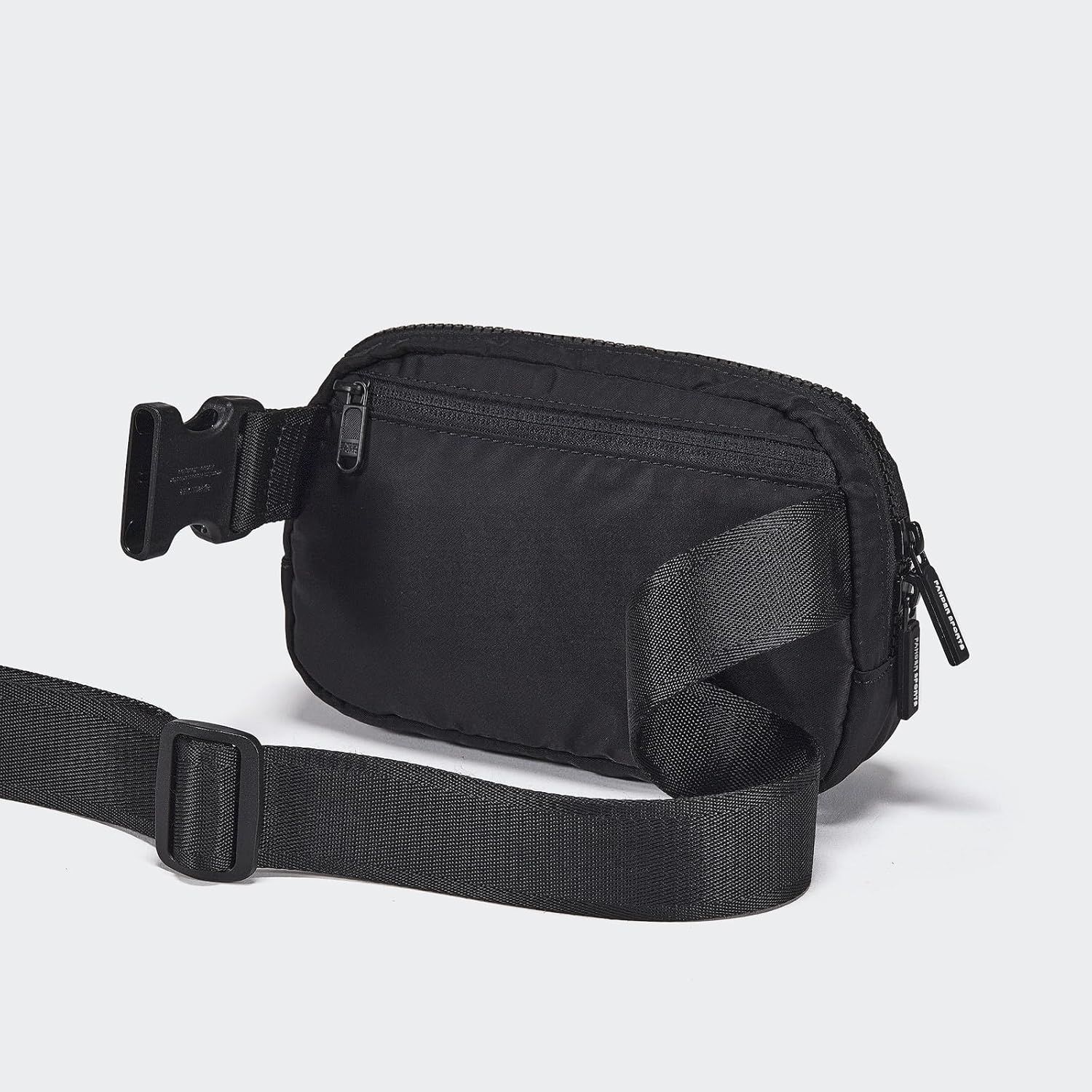 Provides a clean, catalog-style view of the black fanny pack/belt bag to show the product's design, structure, and adjustable strap without distractions.