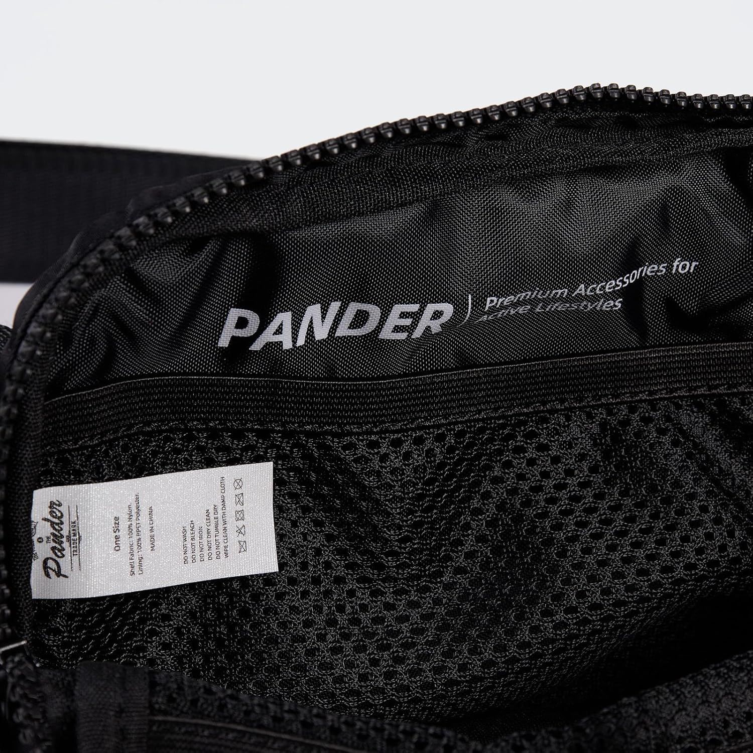 Shows a close-up detail of the product's branding, zipper, and material quality to help shoppers understand the product's construction and brand identity.