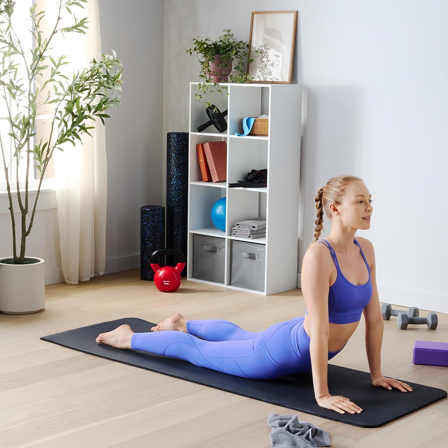 Demonstrates the product in use within a real home fitness setting to help shoppers visualize how the product fits into their lifestyle and workout routine.
