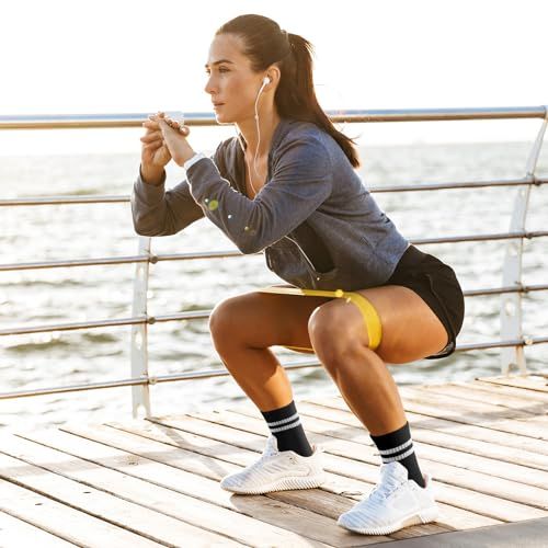 Demonstrates the product (resistance band) being used in a real-world outdoor fitness setting to help shoppers visualize how they can incorporate it into their own workout routine.