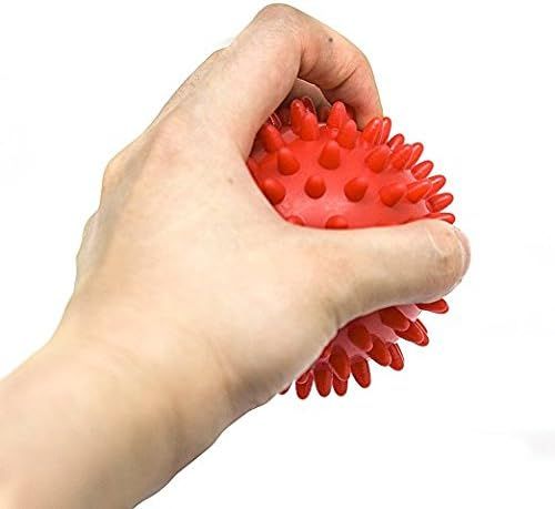Shows the product in real-world use to help shoppers visualize how the massage ball fits in the hand and how it's used for muscle relief.
