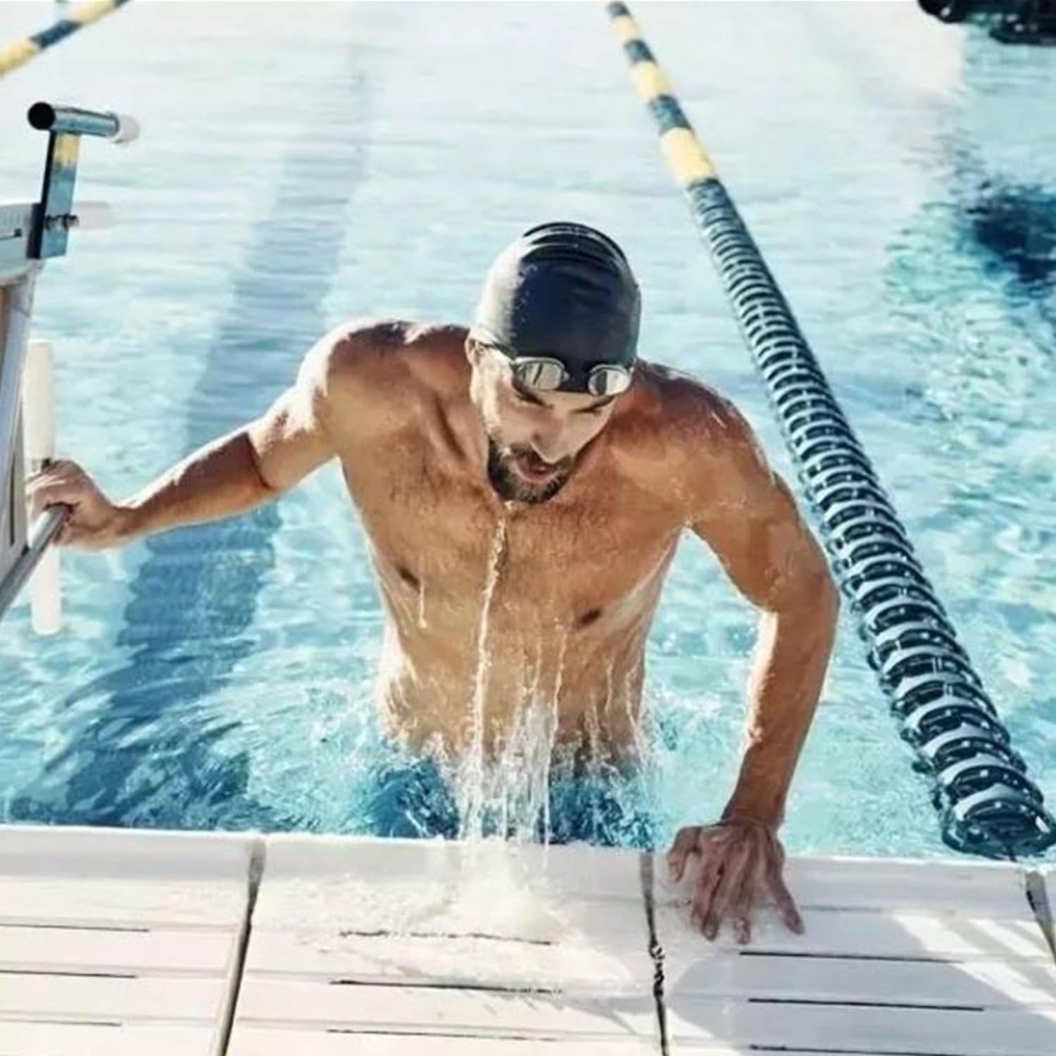 Demonstrates the product (swim goggles and cap) in an authentic real-world swimming context to help shoppers visualize the product in use.