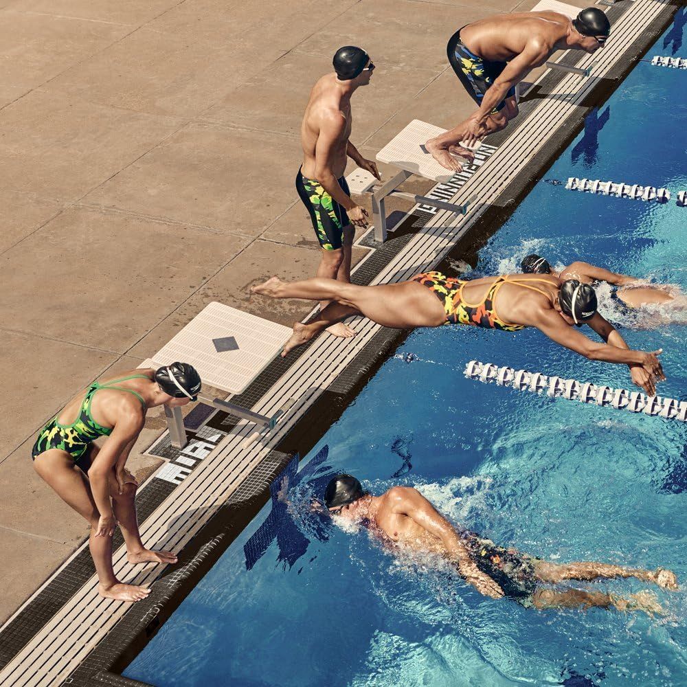 Shows the product (swimwear) being used in a real-world competitive swimming environment to help shoppers visualize the product in action during athletic training.