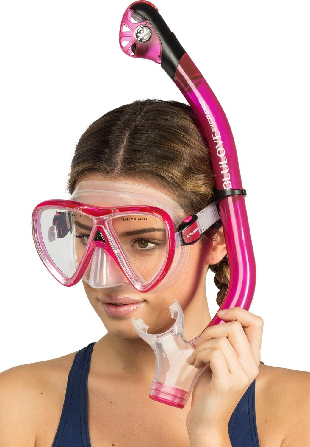 Shows the snorkel and mask set being worn by a model to help shoppers visualize the product in use and understand how it looks when worn.
