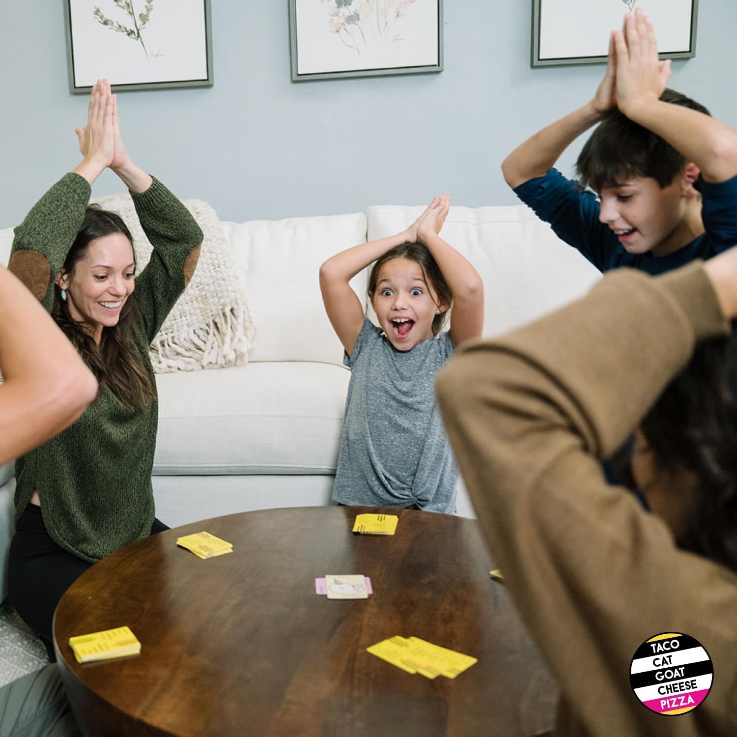 Shows the product being enjoyed by a family in a real home setting, creating an emotional connection and demonstrating the product's ability to bring people together for fun and entertainment.