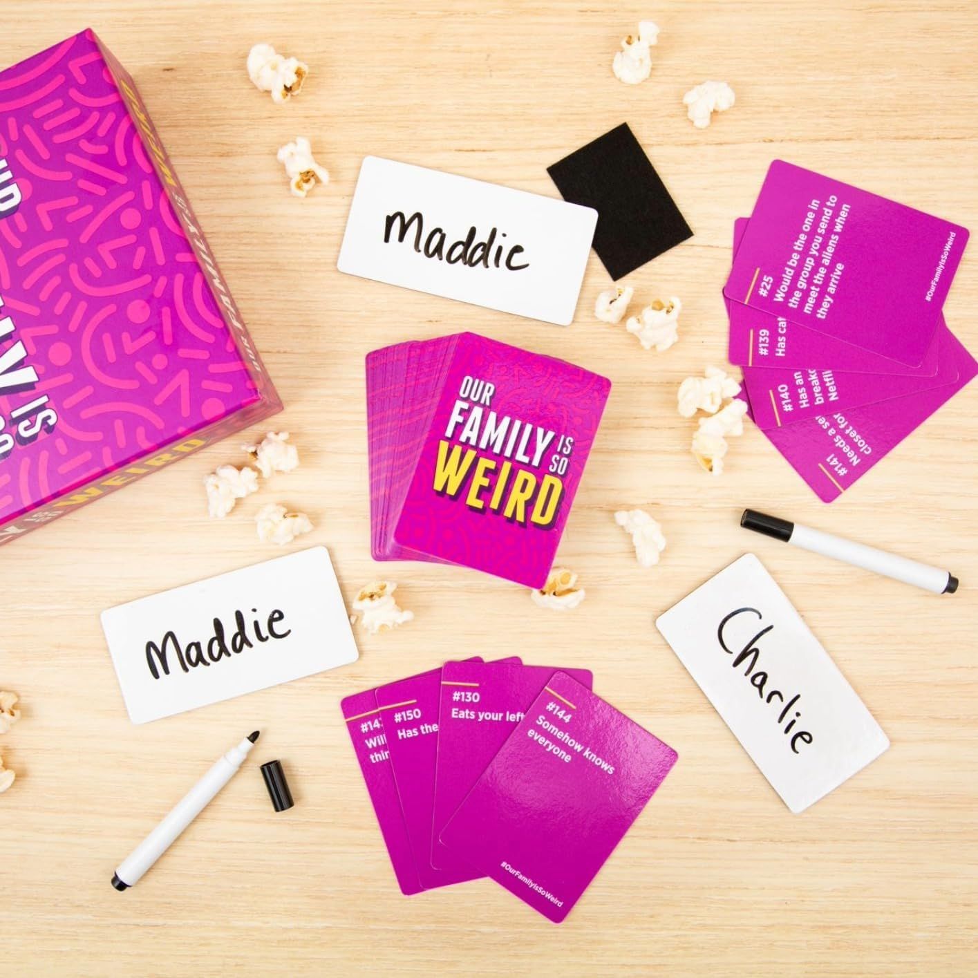 Shows everything included in the game package to help shoppers understand the full contents they will receive, including game cards, name tags, markers, and the game box.