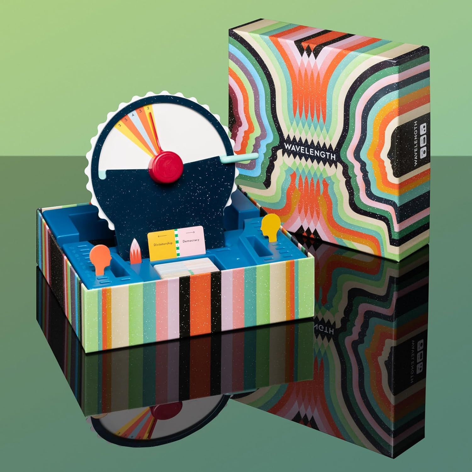 Shows all the components included in the Wavelength game box, including the dial mechanism, card holders, and game pieces, to help shoppers understand what they receive with their purchase.