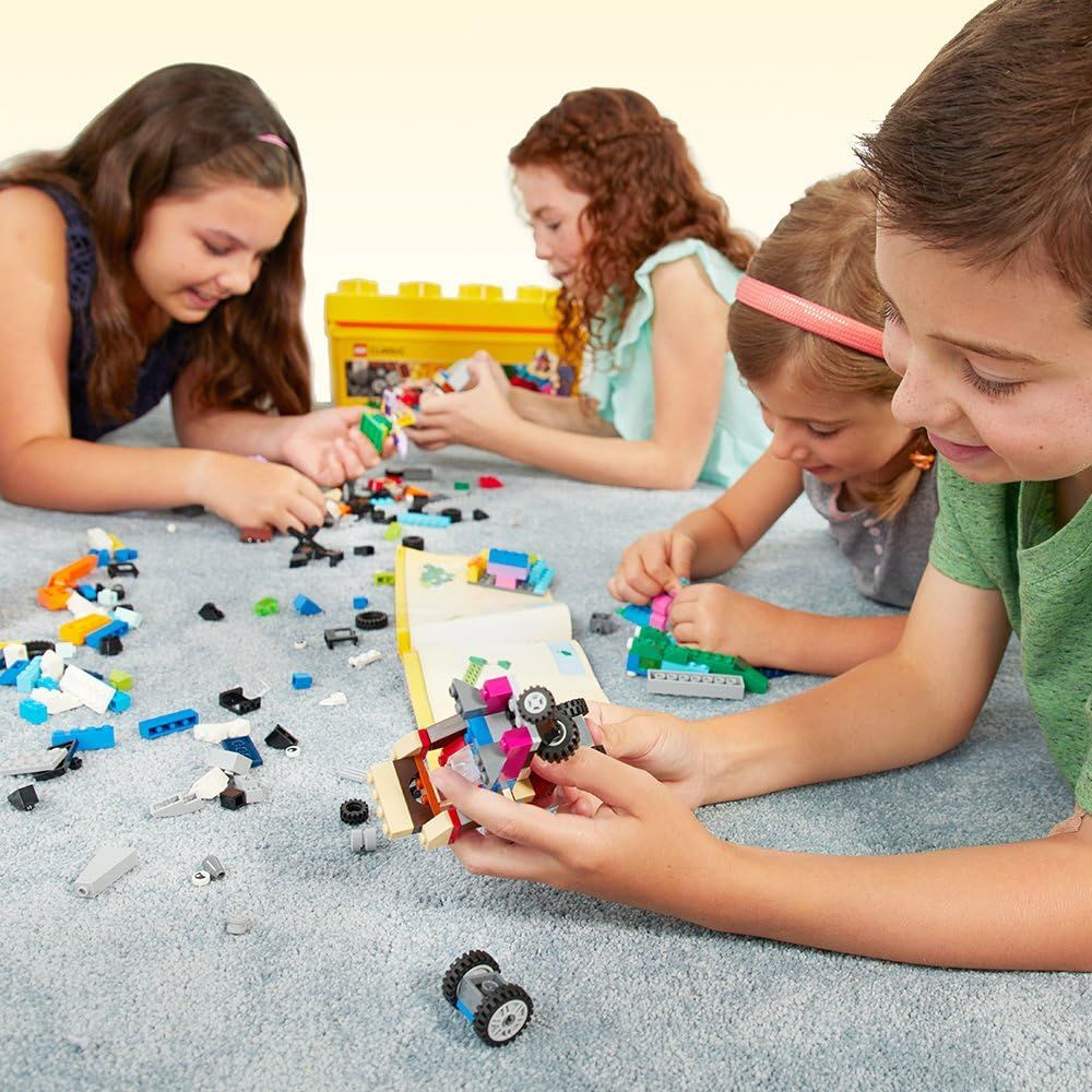 Shows children enjoying the product together in a real-world play setting, helping shoppers visualize the product being used by multiple kids in a home environment.