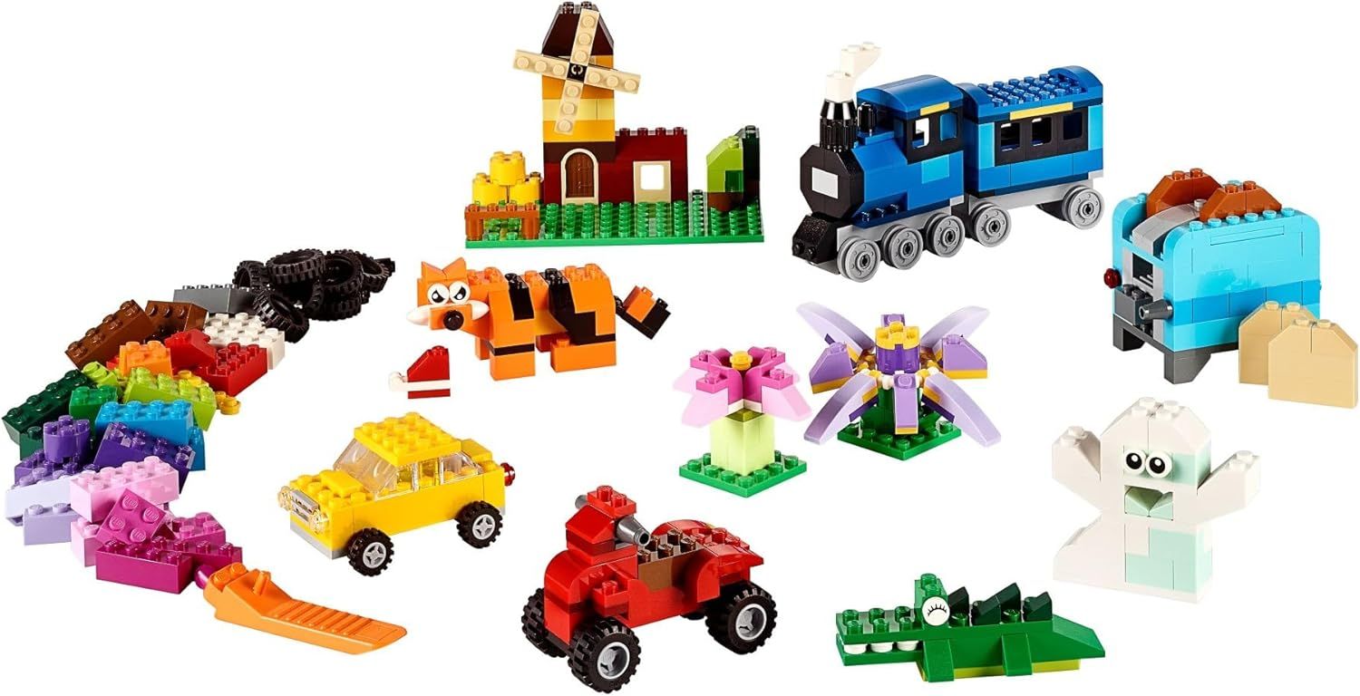 Shows all the pieces, vehicles, animals, and structures included in the LEGO set to demonstrate the variety and value of what the customer receives.