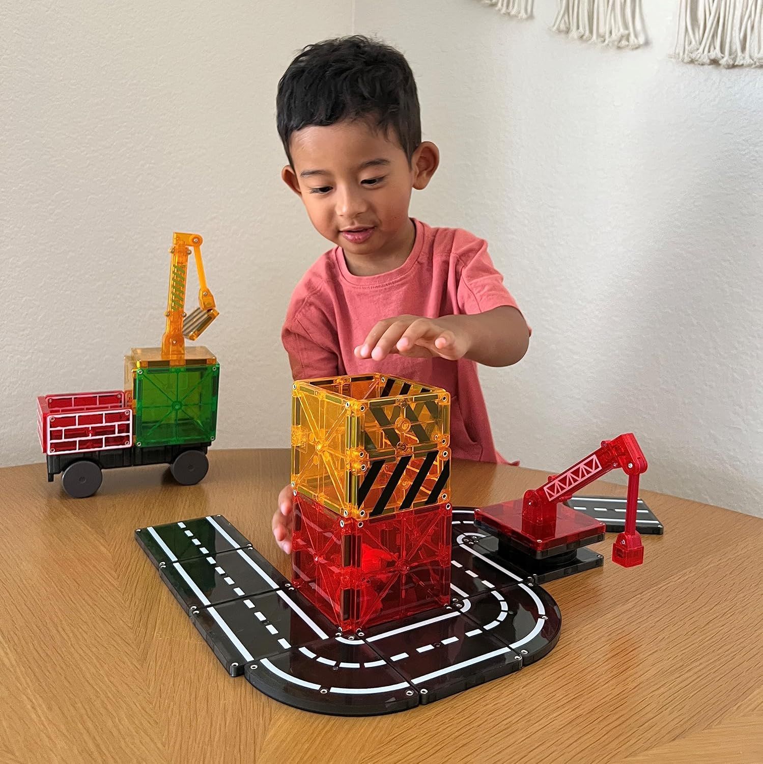 Demonstrates the product in a real-world home setting with a child actively engaged in play, helping shoppers visualize how the toy will be used and enjoyed.