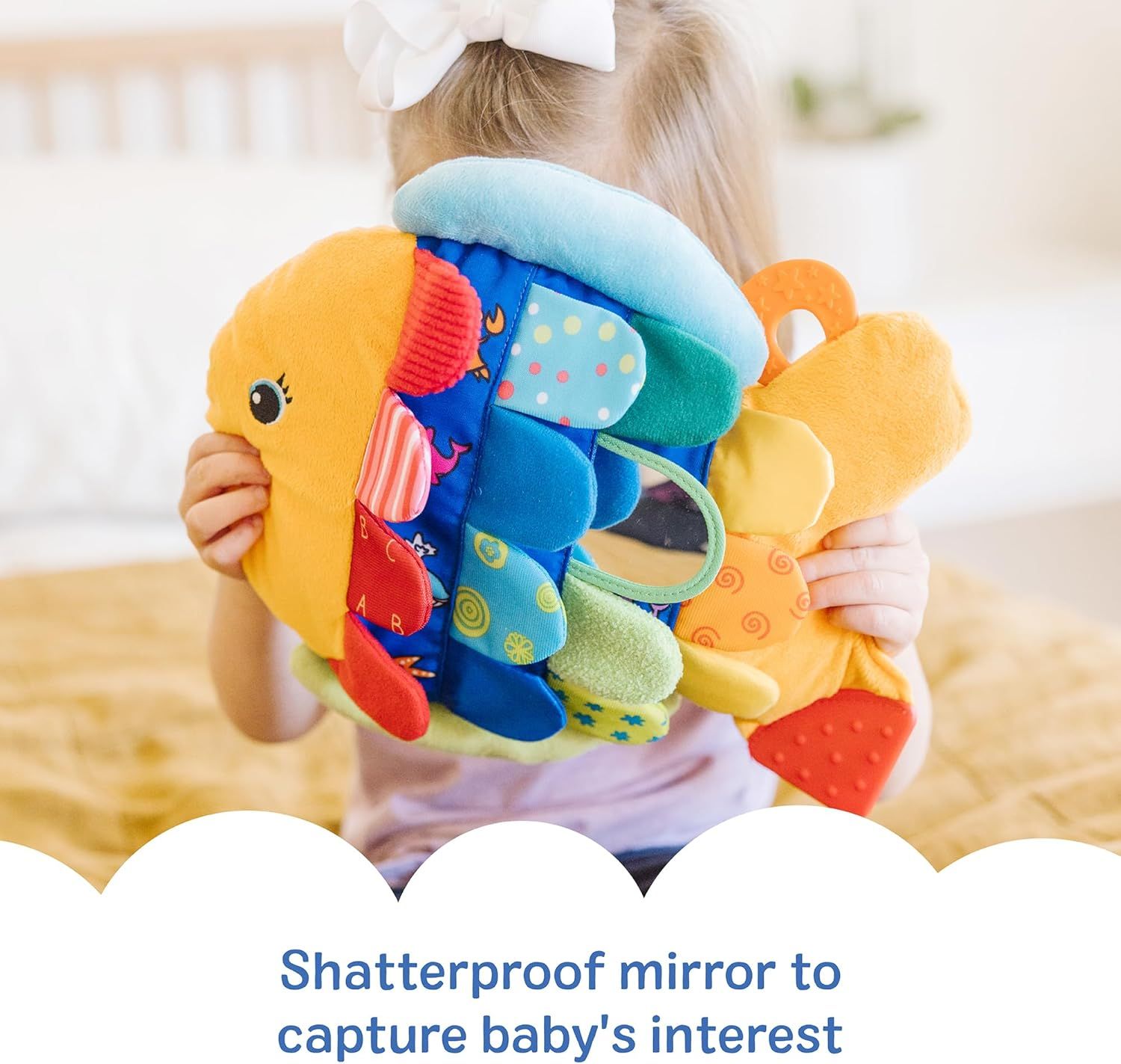 Highlights the shatterproof mirror feature designed to safely capture and hold baby's attention during play.