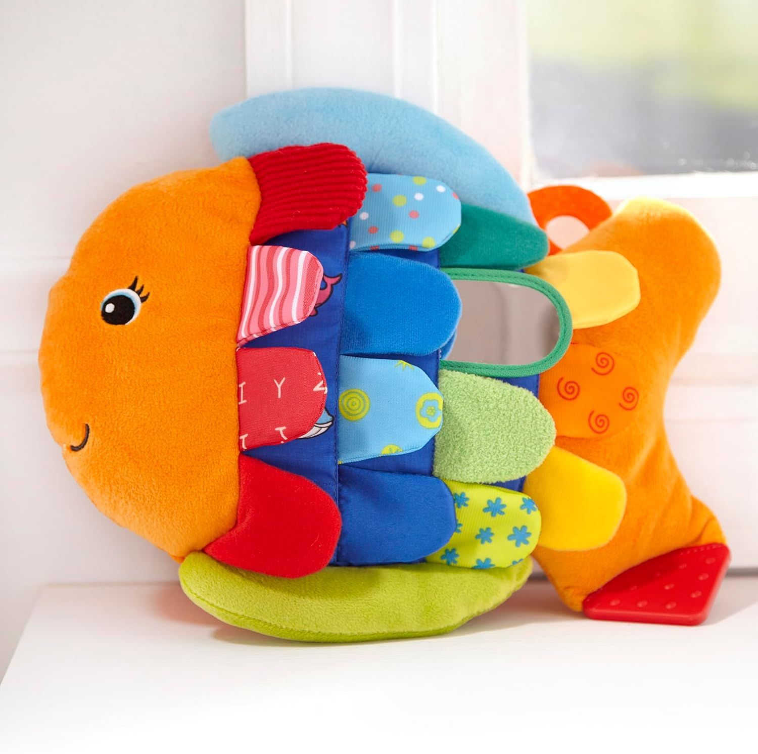 Provides a clean, distraction-free view of the colorful fish-shaped baby toy to help shoppers see the product clearly and understand its design and construction.