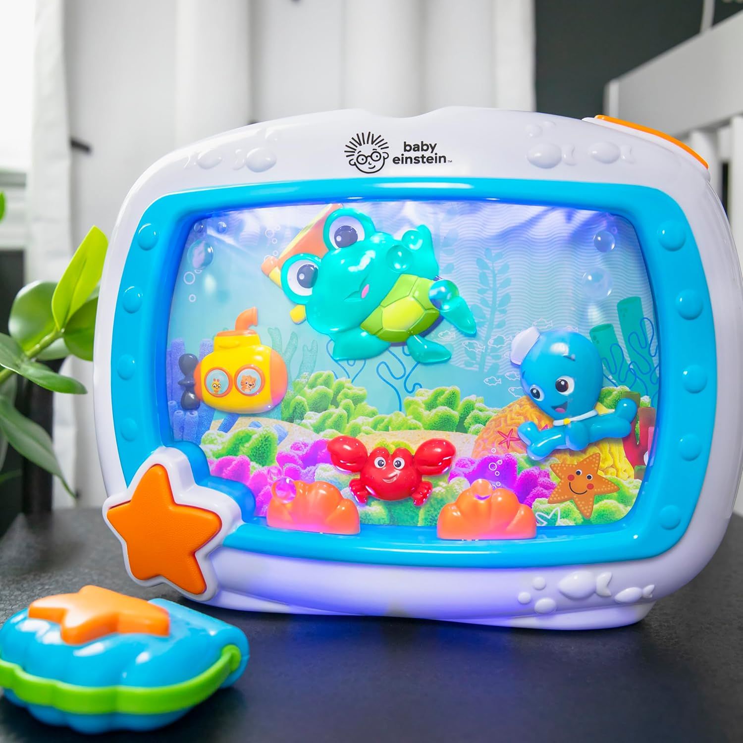 Displays the Baby Einstein aquarium toy in a clean, uncluttered setting to show the product clearly without distractions.