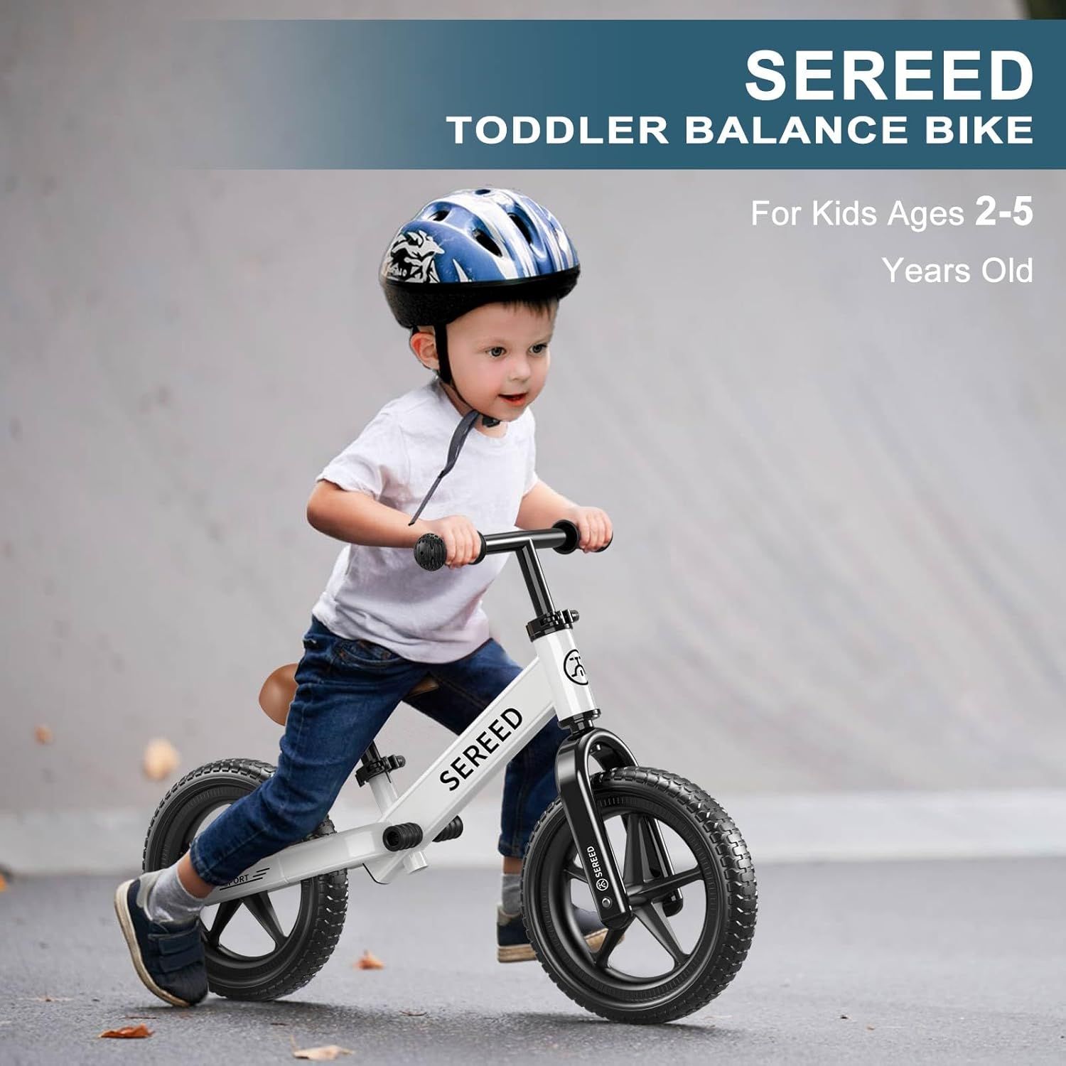 Shows the product in authentic use by a toddler in a real-world outdoor setting, helping parents visualize how their child would use the balance bike.