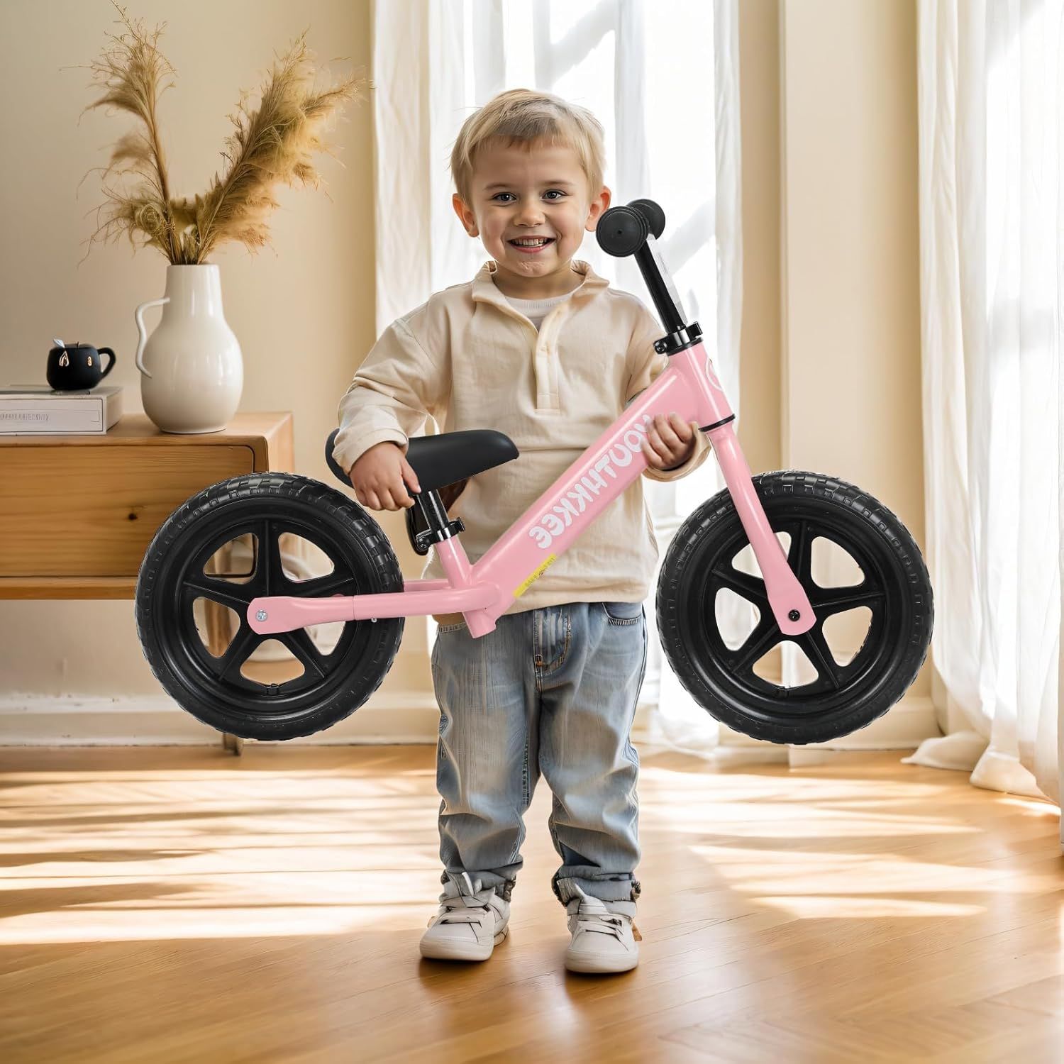 Demonstrates the product in a real-world home setting to help shoppers visualize how the balance bike fits into everyday life and appeals to young children.