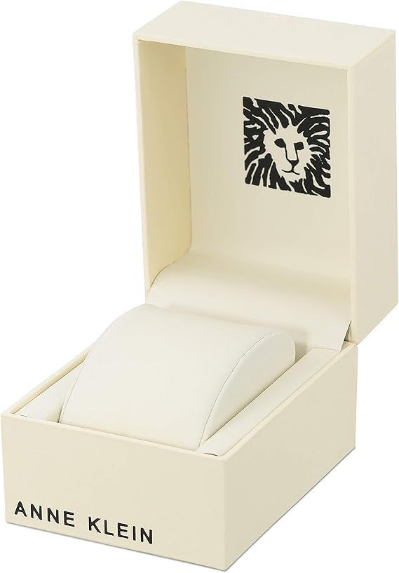 Showcases the Anne Klein brand identity through premium packaging with the brand's signature lion logo, reinforcing brand recognition and luxury positioning.