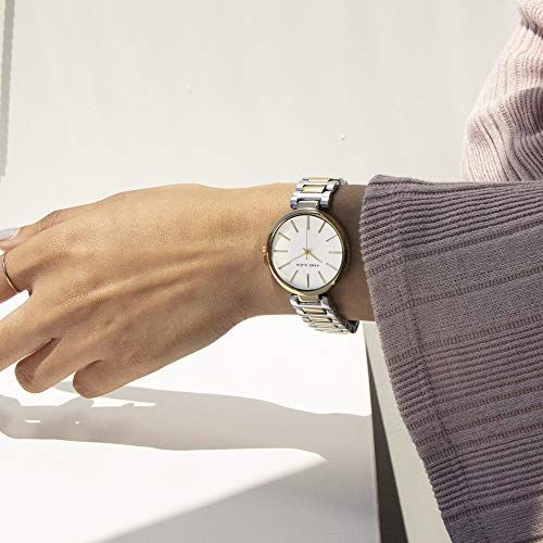 Shows the watch being worn in a real-world lifestyle context to help shoppers visualize how it looks on the wrist and fits into everyday style.