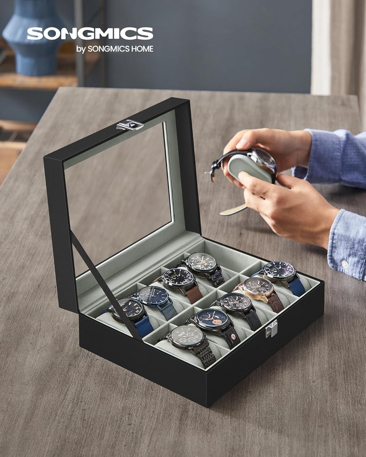 Shows the customer what they receive with their purchase: a premium watch storage case with organized compartments for multiple watches, demonstrating the product's capacity and elegant presentation.