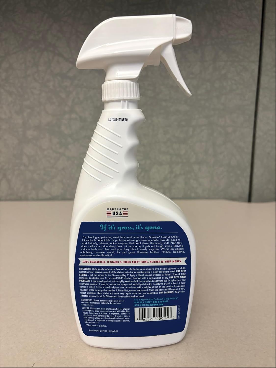 Displays the product in a clean, catalog-style format to show the physical appearance and packaging design of the stain and odor eliminator spray bottle.