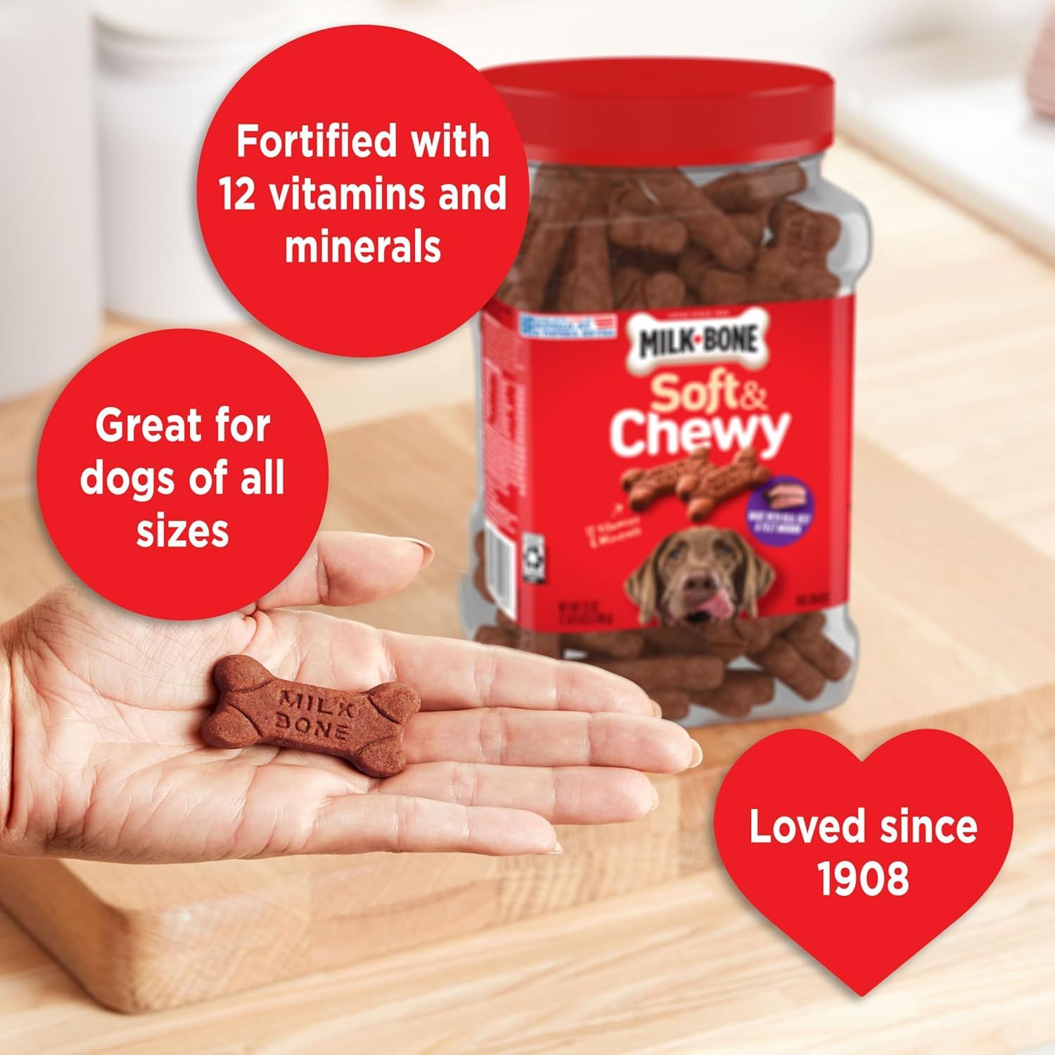 Communicates multiple distinct selling points of the dog treat: nutritional fortification, universal sizing suitability, and long-standing brand trust to reassure shoppers of quality and versatility.