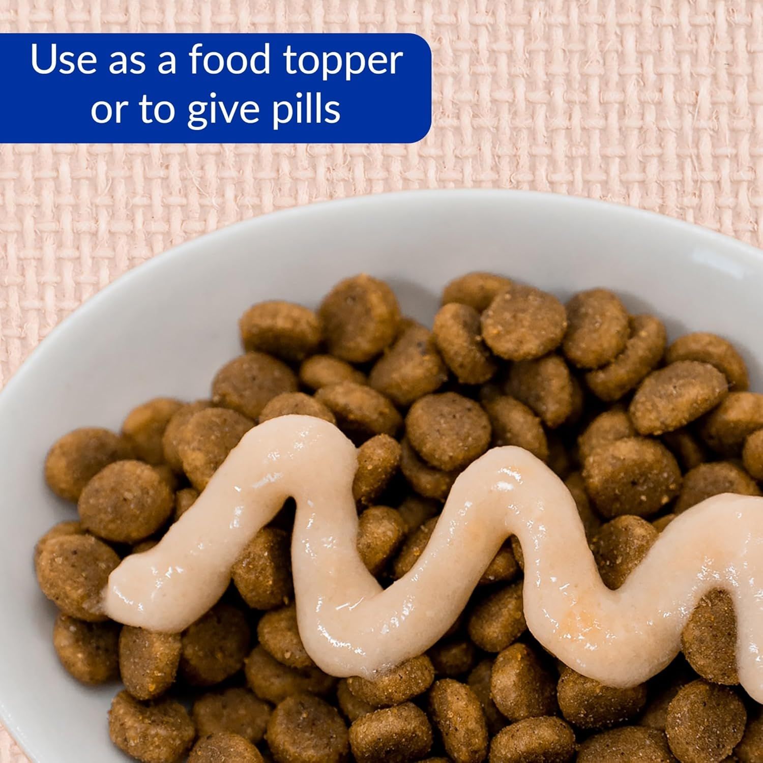 Demonstrates that the product can be used both as a food topper and as a vehicle for giving pills to pets, highlighting its versatility and practical benefit for pet owners.