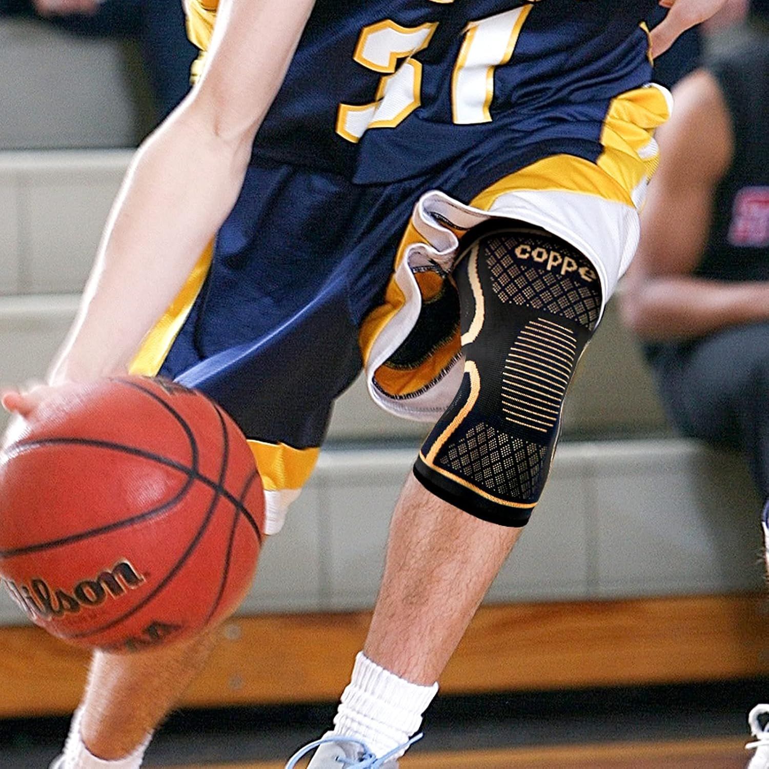 Demonstrates the knee brace product in action during basketball play, showing how it provides support and stability during athletic activity to reassure shoppers of its real-world effectiveness.