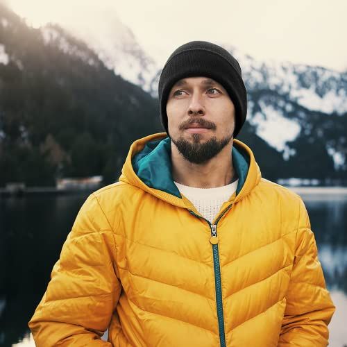 Demonstrates the product being used in a real-world outdoor mountain environment to show its suitability for cold weather and outdoor activities.