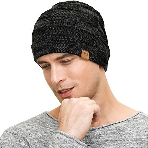 Demonstrates the product worn in a natural, real-world context to help shoppers visualize fit, style, and how the beanie looks when worn.