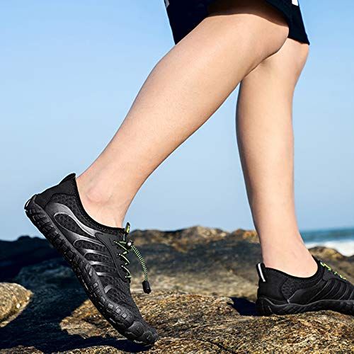 Demonstrates the product in a real-world outdoor coastal environment to show shoppers the shoes are suitable for active outdoor and water-adjacent activities.