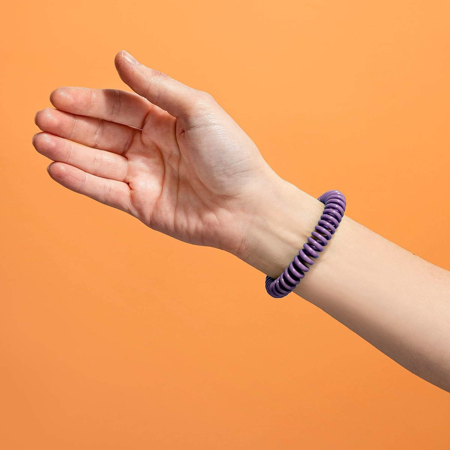 Shows the product worn on a wrist in a real-world context to help shoppers visualize how it looks when worn, without any text or feature callouts.