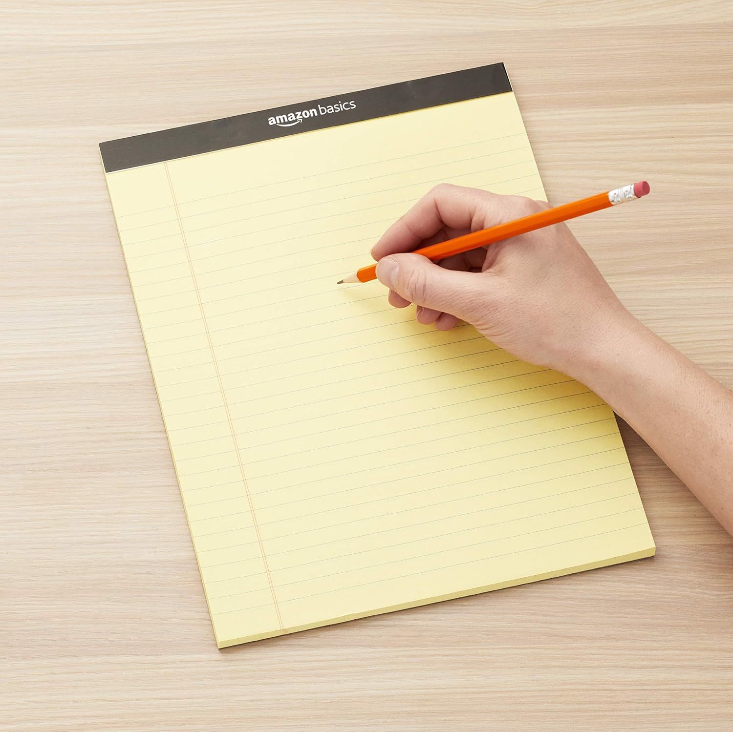 Shows the notepad being used in a real-world office or home setting to help shoppers visualize the product in everyday use.