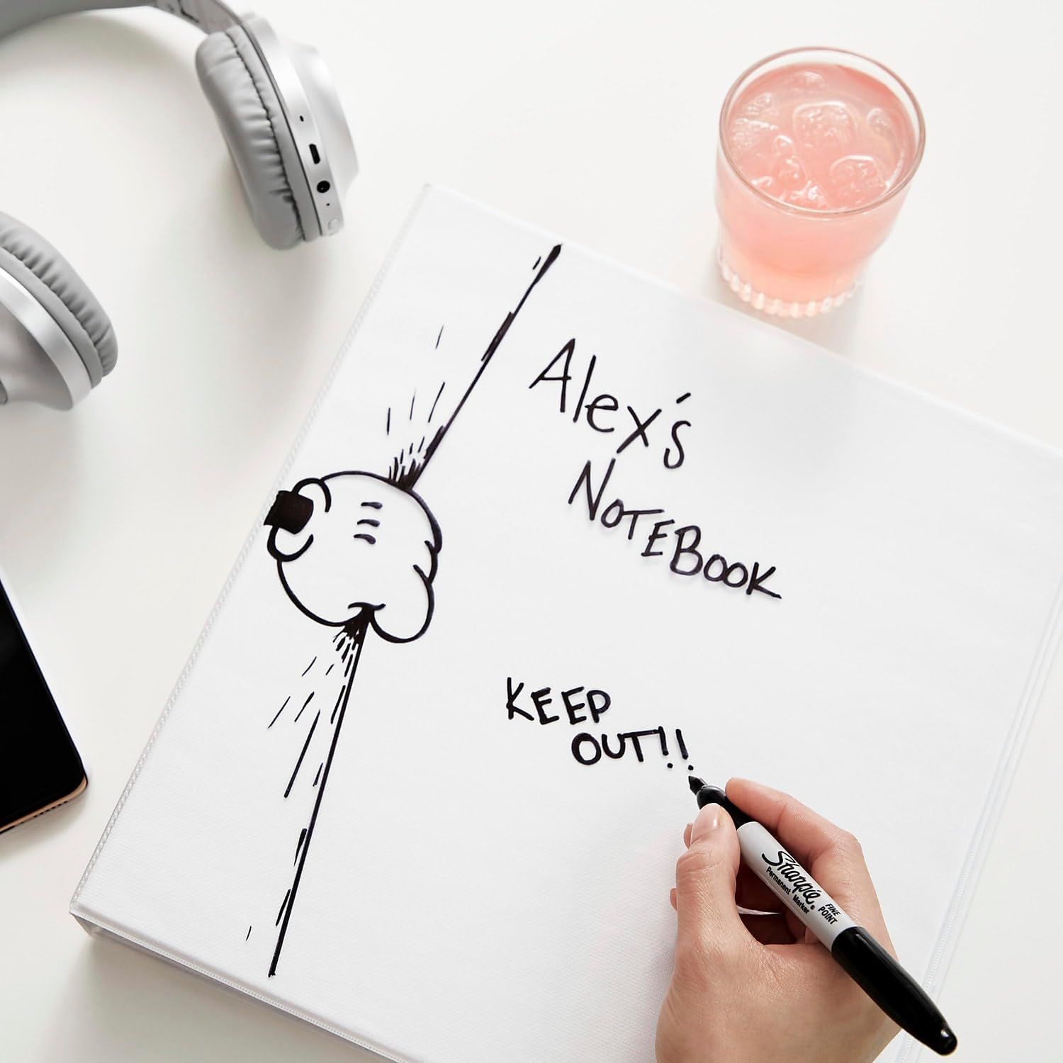 Shows the notebook in a natural, everyday lifestyle setting to help shoppers visualize how they might use the product in their own life.