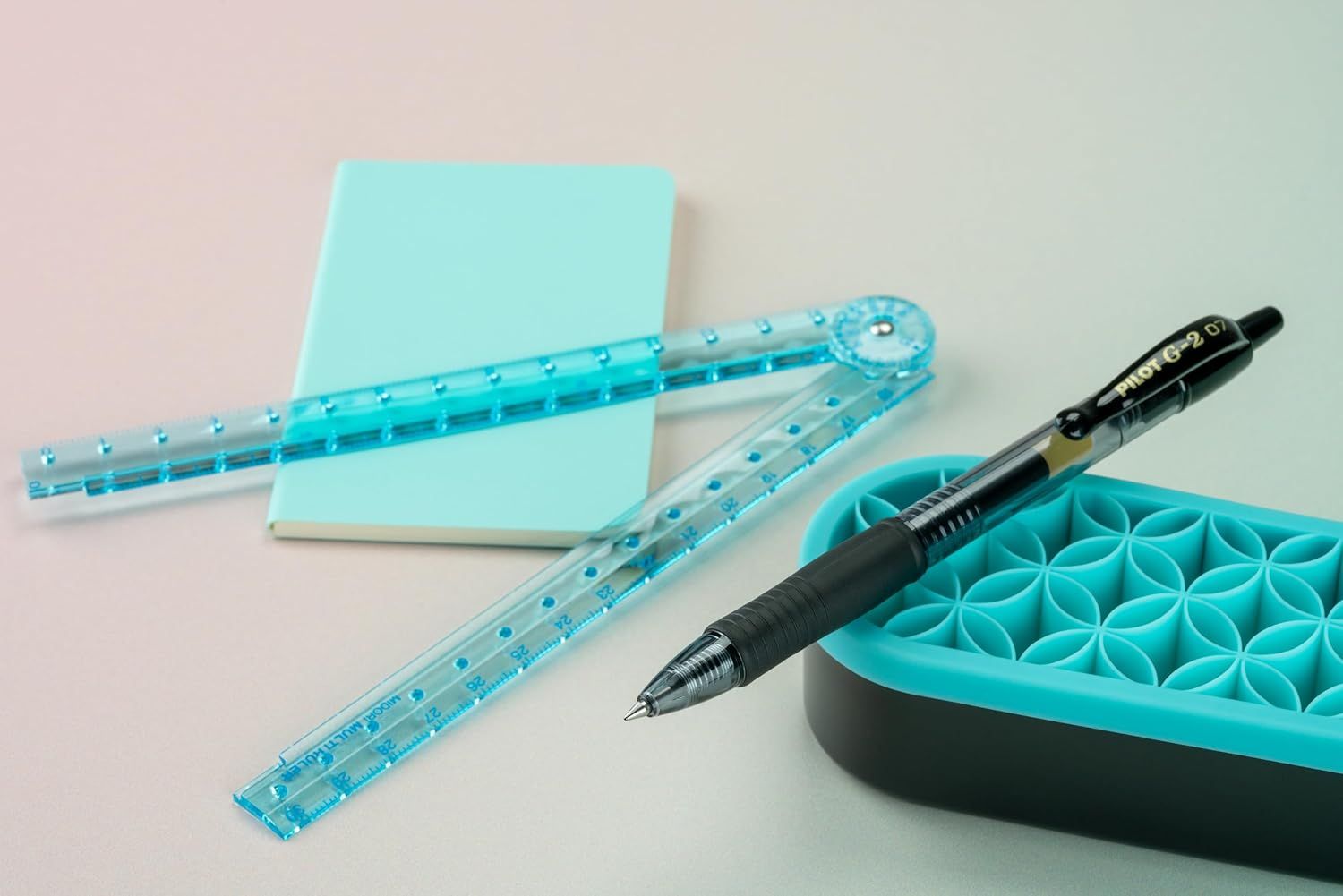 Shows all the items included in the purchase, helping shoppers understand the complete value of the bundle with coordinated turquoise-themed stationery tools.