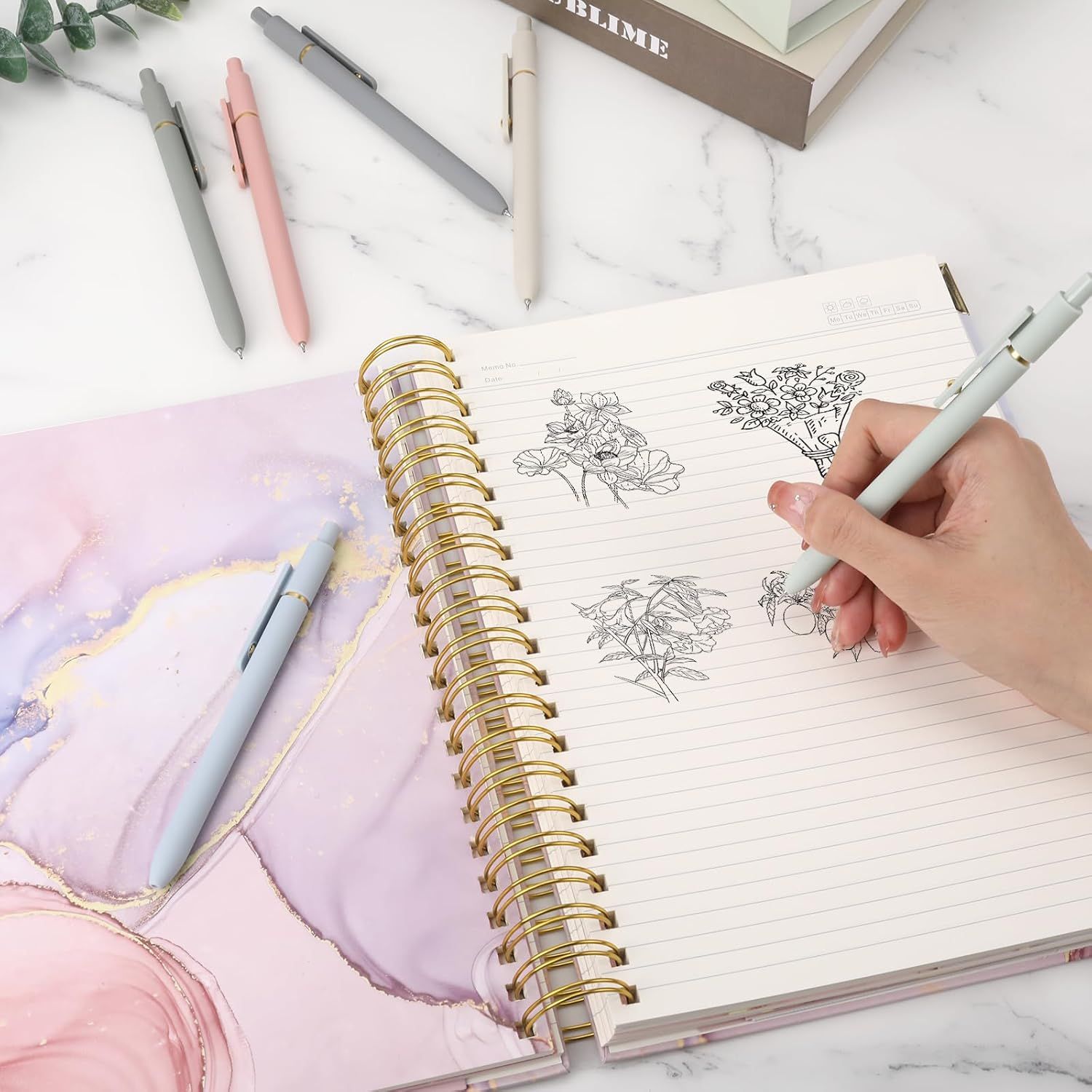 Shows the product being used in a real-world lifestyle setting to help shoppers visualize how they would use the notebook in their daily life.