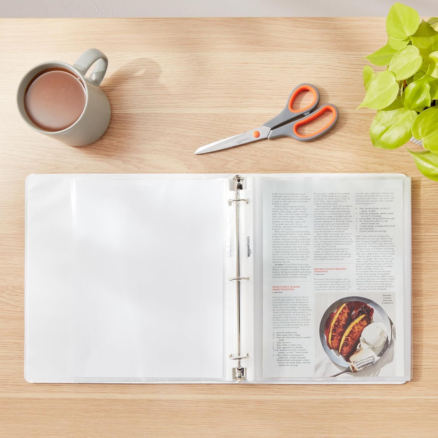 Shows the product (recipe binder) in a natural, relatable home environment to help shoppers visualize how they would use it in their own kitchen or workspace.