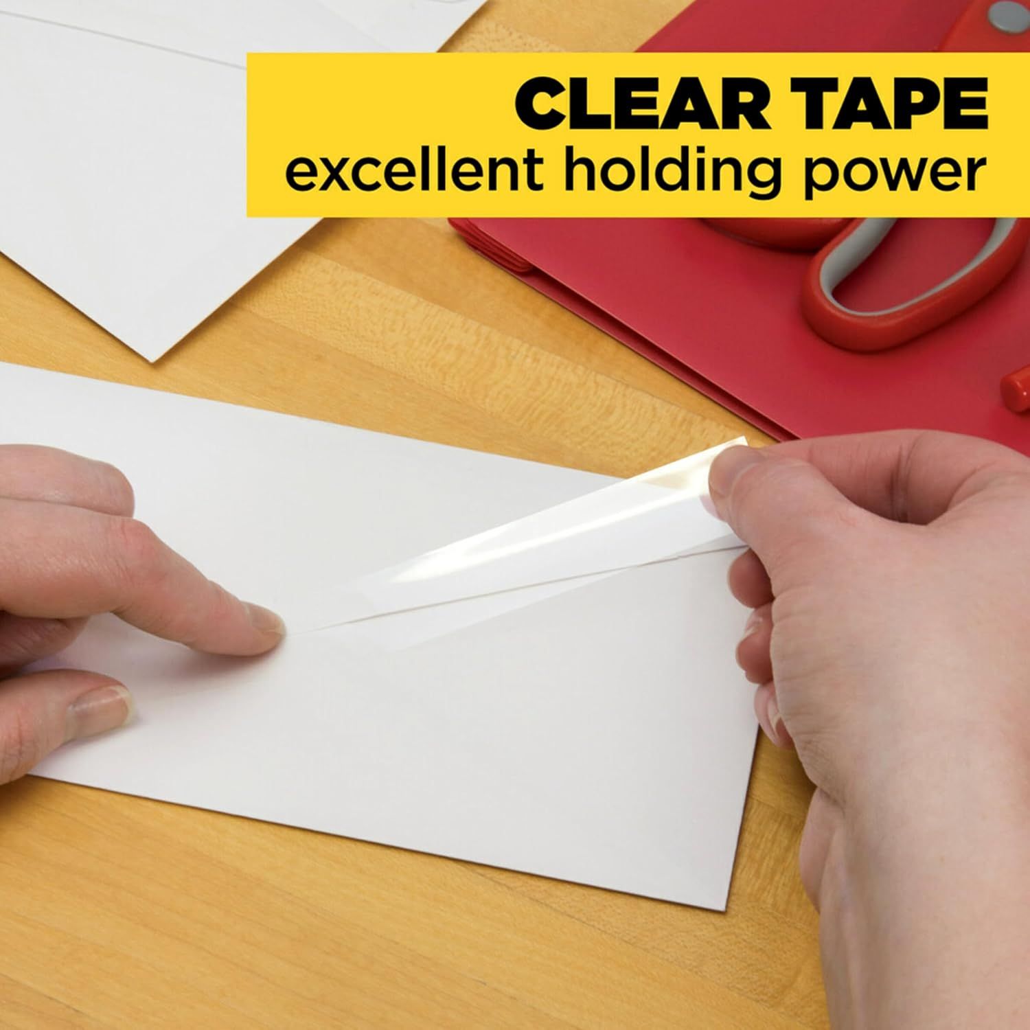 Demonstrates the clear tape's excellent holding power through a hands-on demonstration, reassuring shoppers of its strong adhesive performance.