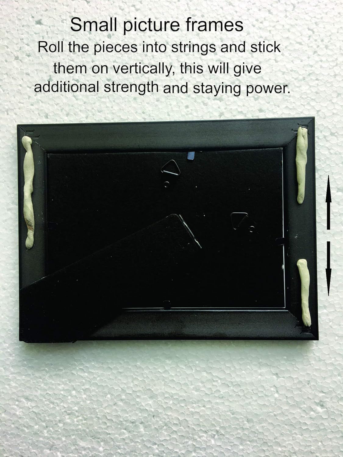 Instructs shoppers on the proper method to attach small picture frames using rolled adhesive strings applied vertically for enhanced strength and staying power.