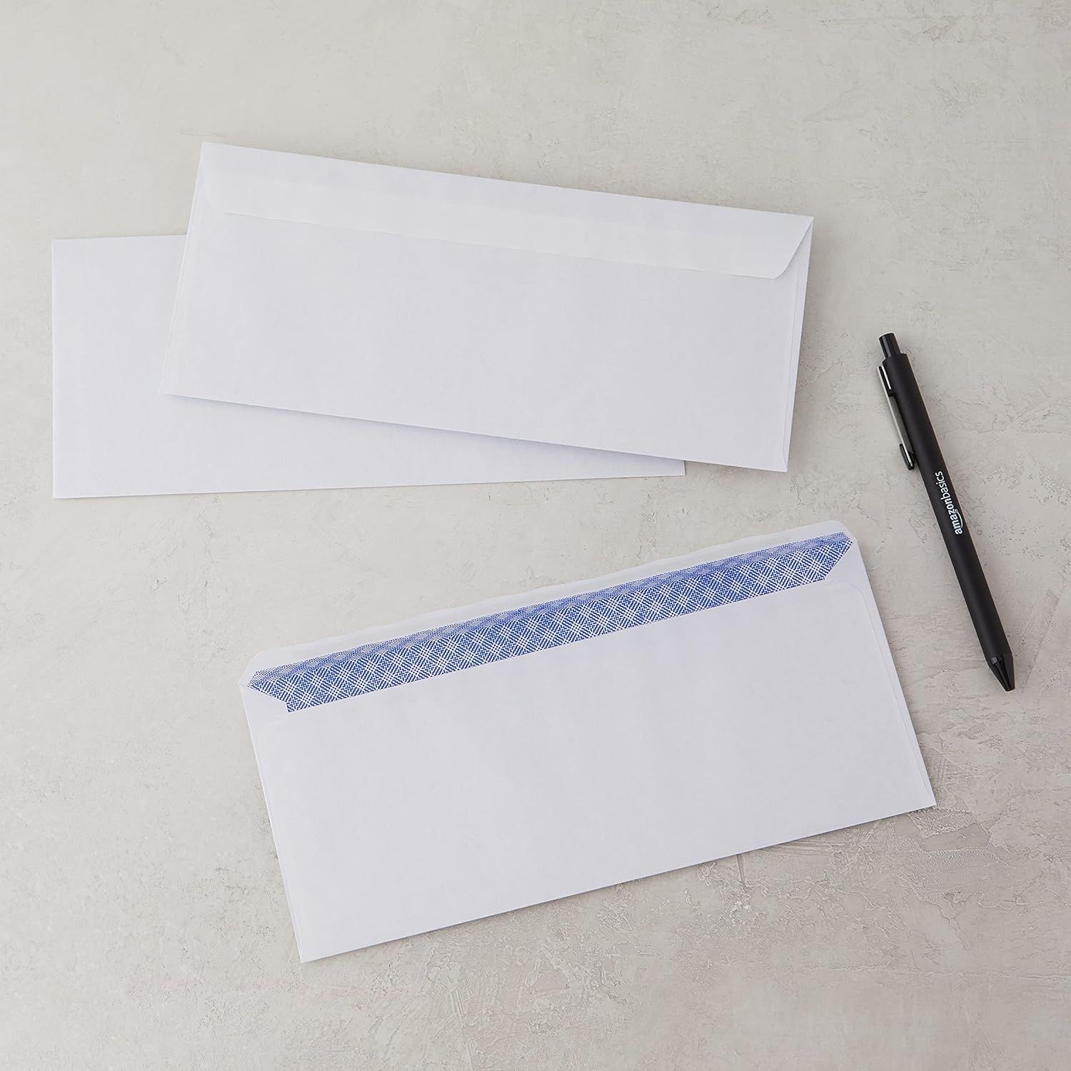 Shows the customer everything included in the purchase: multiple envelopes with security lining and a pen, demonstrating the complete package they will receive.