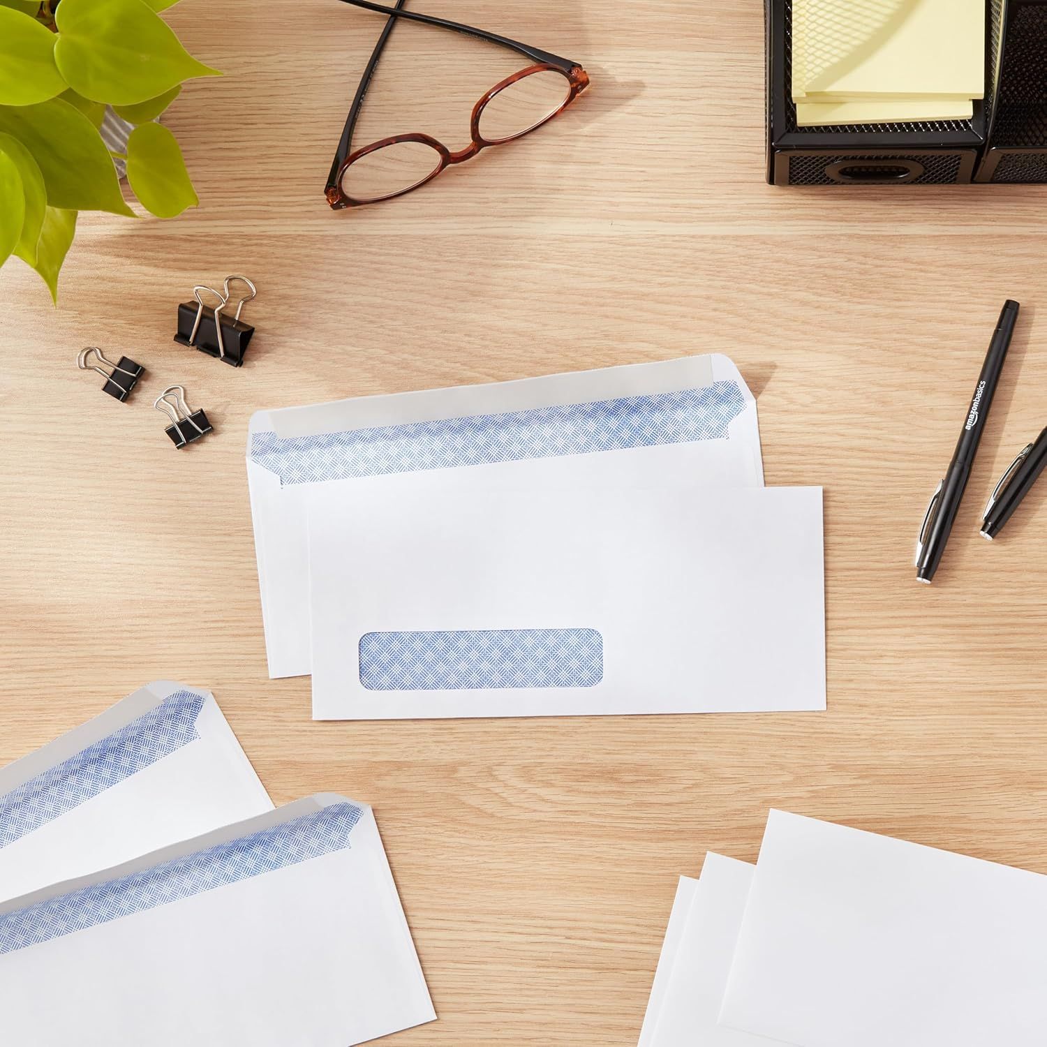 Demonstrates the product in a real-world office setting to help shoppers visualize the envelopes in their everyday work environment.