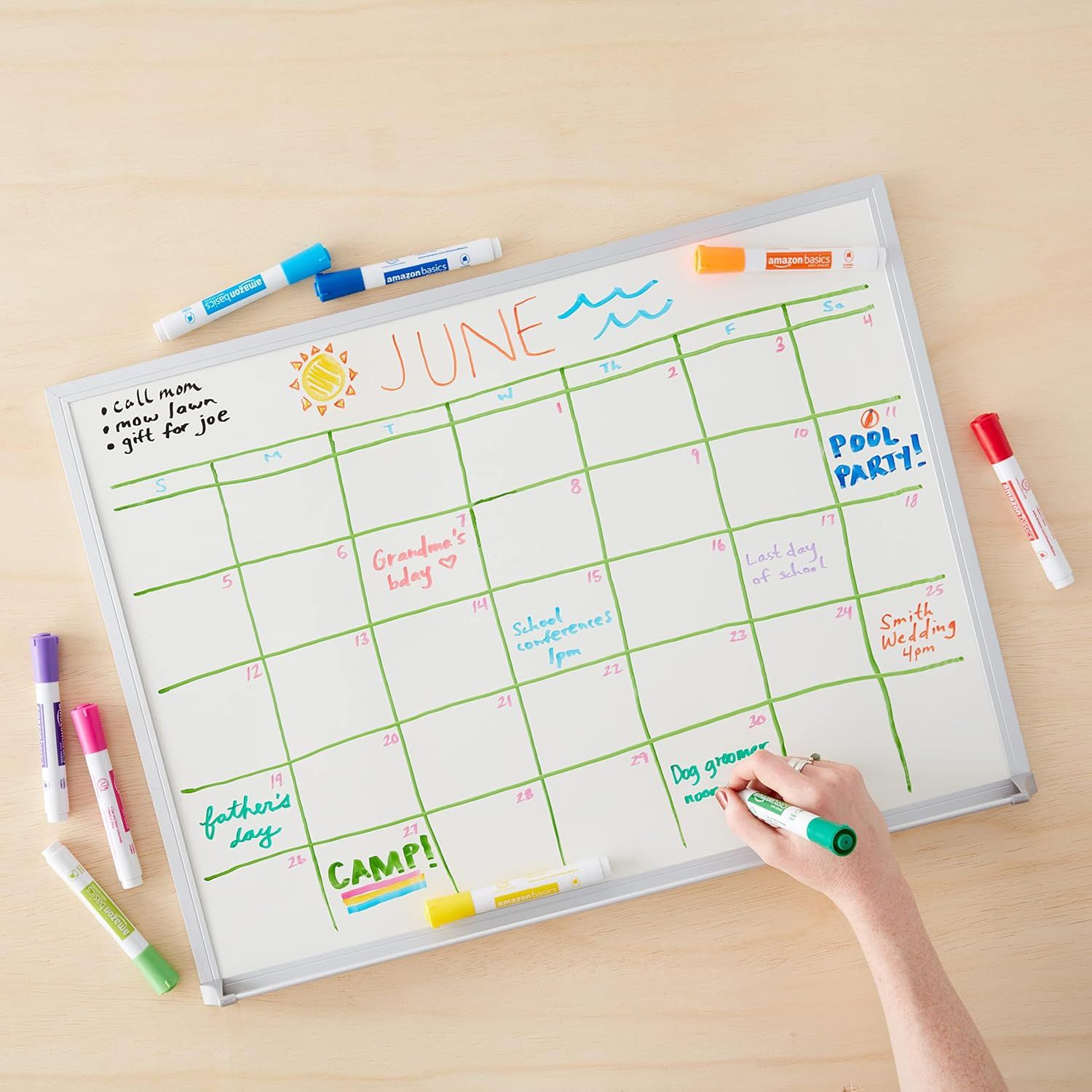 Demonstrates the whiteboard calendar's versatility for organizing family schedules, tracking events, appointments, and activities throughout the month.