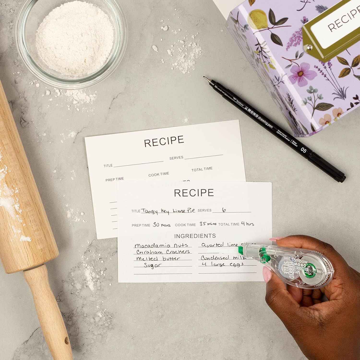 Demonstrates the product (recipe cards) in a real-world baking context to help shoppers visualize how they would use the cards in their own kitchen.