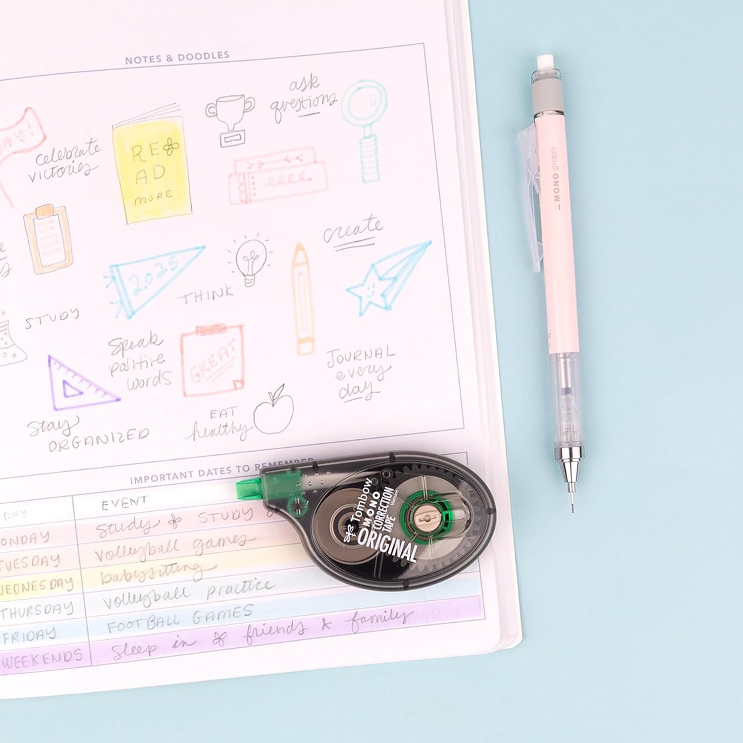 Shows the customer everything included in the purchase: a planner/journal page, a mechanical pencil, and a correction tape dispenser, demonstrating the product is a complete stationery set ready to…