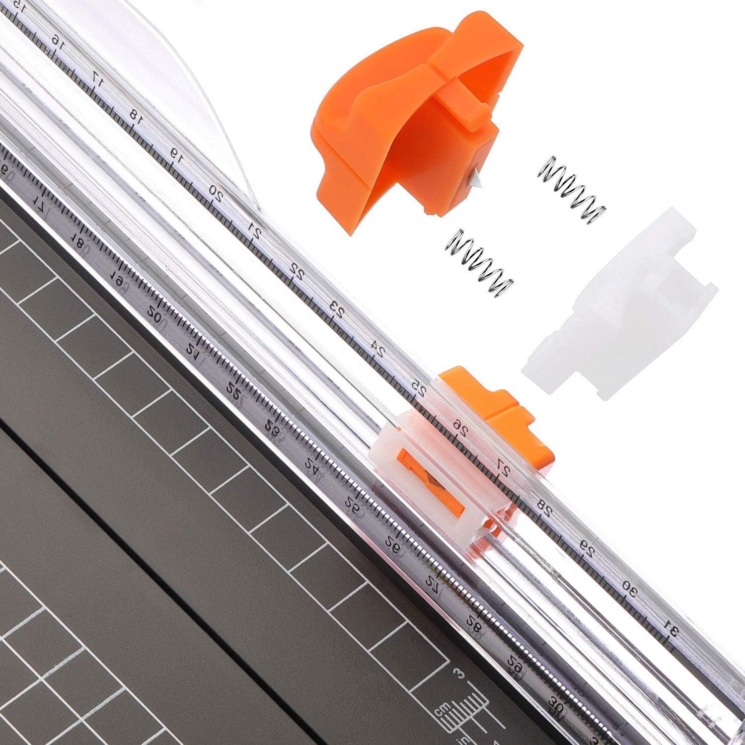 Shows all the components and replacement parts included with the paper trimmer to reassure shoppers they are getting a complete kit with spare blades and accessories.