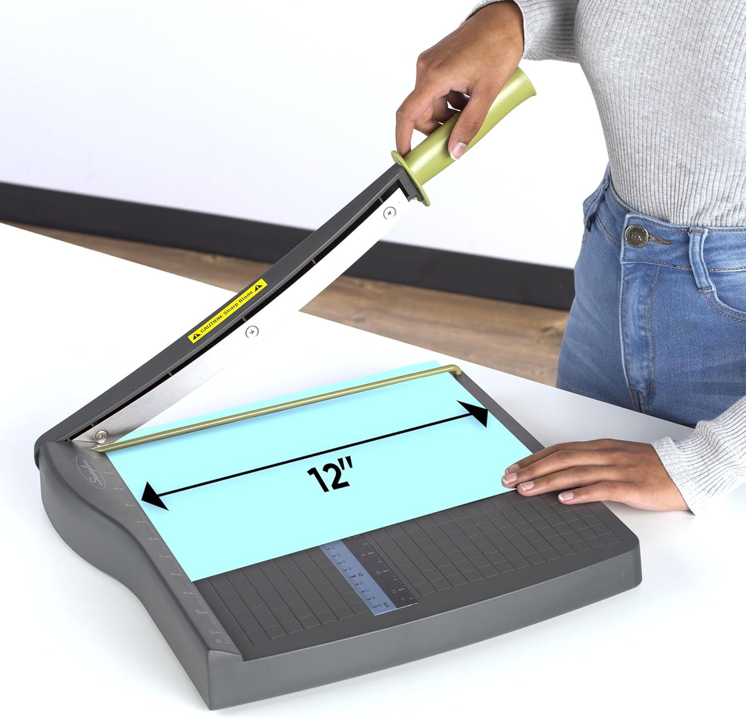 Communicates the maximum cutting width of the paper trimmer to help shoppers understand what size materials it can accommodate. Highlights the 12-inch cutting capacity as a key benefit for shoppers…