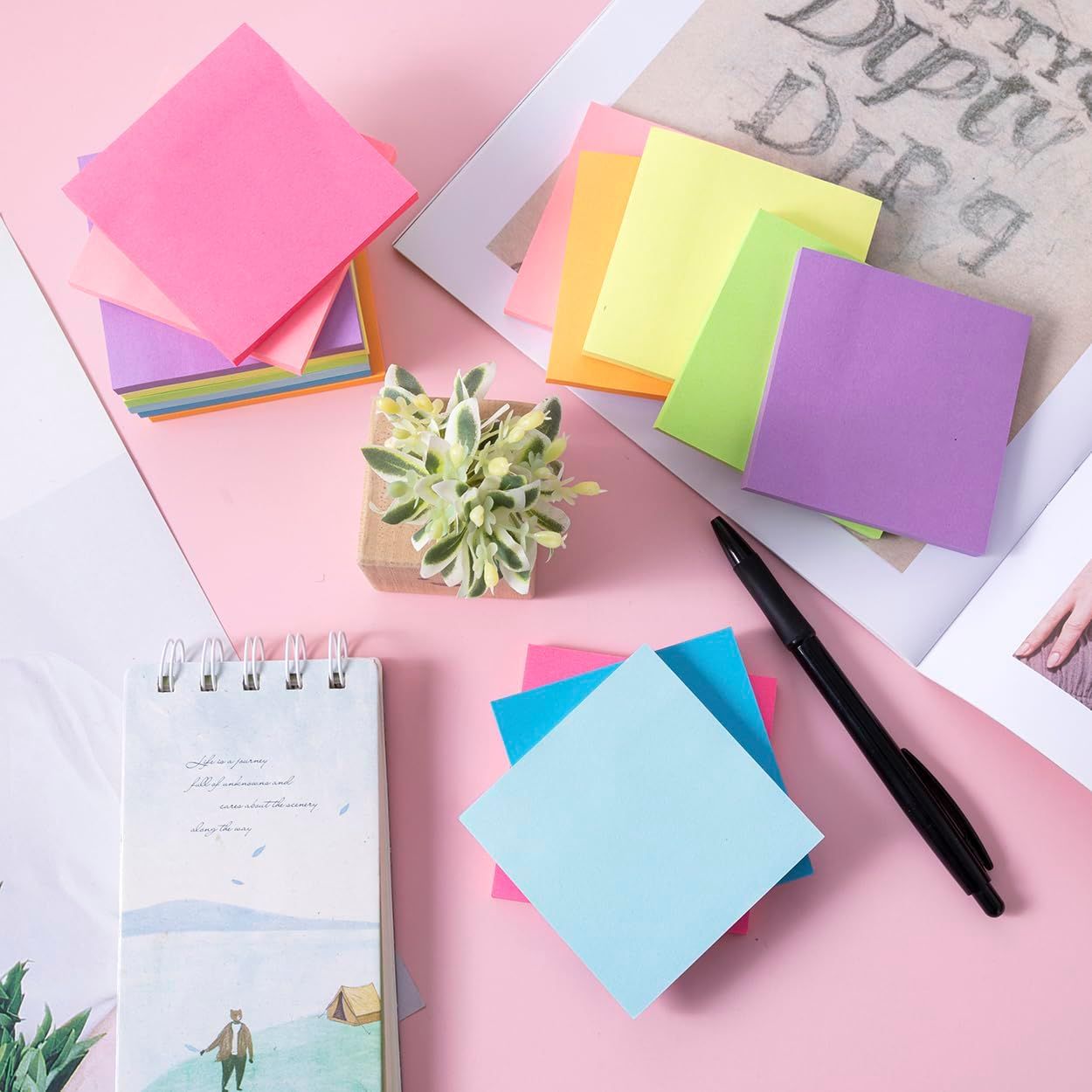 Shows all the colorful sticky notes, notepads, and accessories included in the product bundle to help shoppers understand the variety and value of what they receive.
