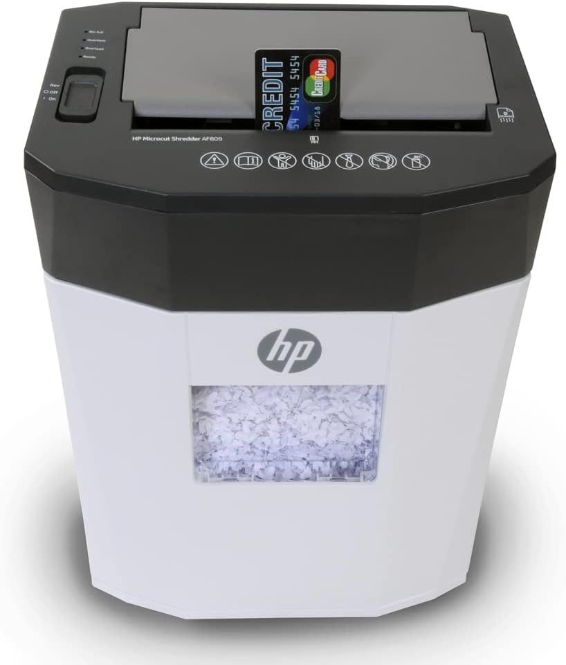 Provides a clean, catalog-style product image showing the HP Microcut Shredder with visible shredded paper in the bin, allowing shoppers to see the product clearly without distractions.
