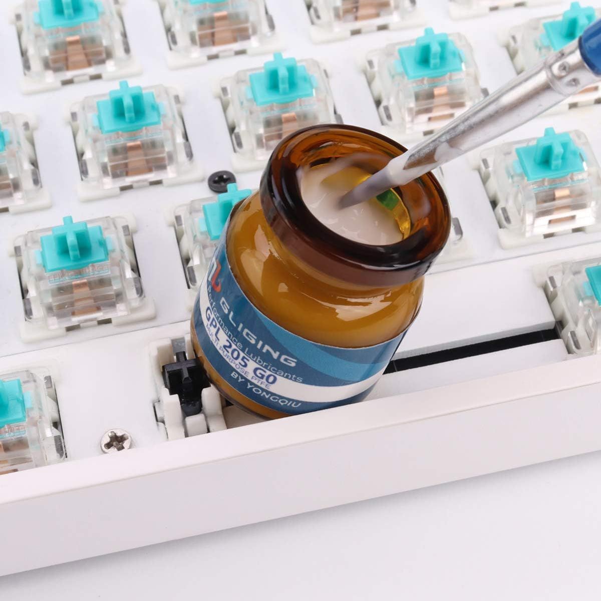 Demonstrates the product being used in a real-world setting to lubricate mechanical keyboard switches, helping shoppers visualize practical application.