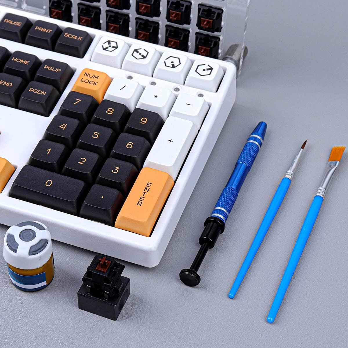 Shows all the items included with the keyboard purchase, including the keyboard itself, tools for maintenance/customization, and spare parts to reassure buyers they have everything needed.